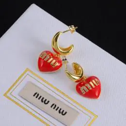 miu miu boucles doreilles pour femme s_1234114